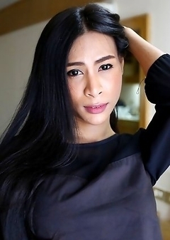 25yo busty Thai shemale Pang strips down to her big tits and cock for her white date