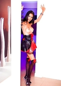 Ladyboy Rose ready for pleasure with a paddle and anal beads